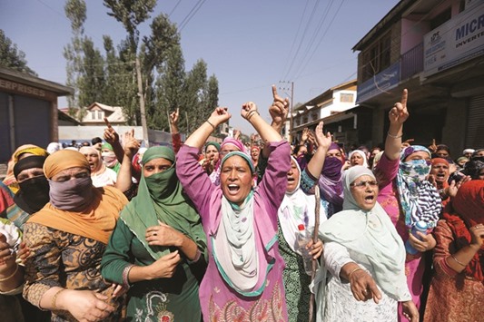 Women shout anti-Indian slogans during a protest against the recent killings in Kashmir, in Srinagar yesterday.