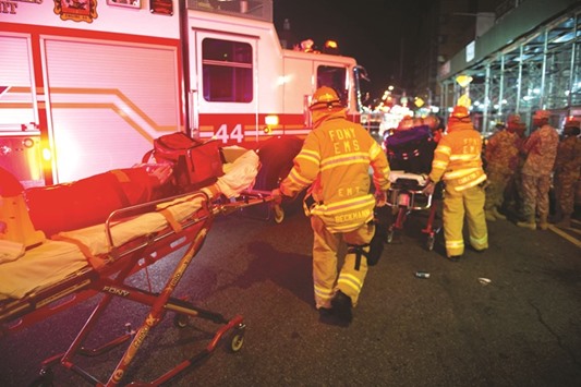 Firefighters respond to an explosion on West 23rd Street in New York on Saturday night.