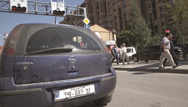A car with a paper u2018probationu2019 licence plate is seen at the Bill Clinton Boulevard in Pristina.