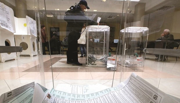 A man casts his ballot at a polling station in Moscow during the parliamentary election.