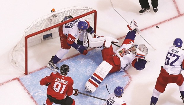 Michal Neuvirth of Team Czech Republic makes a save on his back while playing Team Canada during the World Cup of Hockey in Toronto. (Getty Images/AFP)