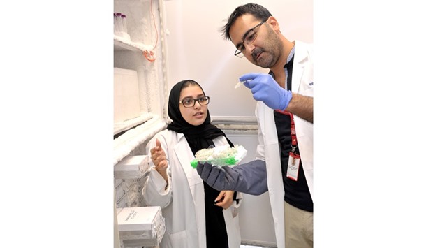Moza al-Hail with Harald Mubarak, laboratory manager, WCM-Q Research