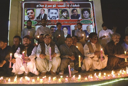 Civil society activists light candles for the victims of the August 8 suicide bombing at the Civil Hospital, in Quetta, yesterday. A devastating suicide bombing at a Quetta hospital on August 8 killed at least 73 people, many of them senior lawyers.