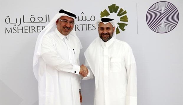 Msheireb Properties CEO Abdulla Hassan al-Mehshadi and Qatar Financial Centre CEO Yousuf al-Jaida shake hands after a joint press conference on Monday. PICTURE: Jayaram.