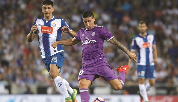 Real Madridu2019s James Rodriguez (right) kicks the ball to score during the La Liga match against RCD Espanyol in Cornella de Llobregat on Sunday. (AFP)