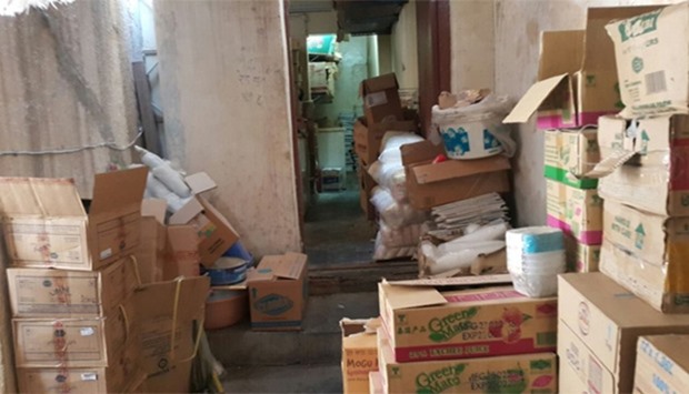Illegal storage of food items inside a workers' accommodation in Bin Omran.