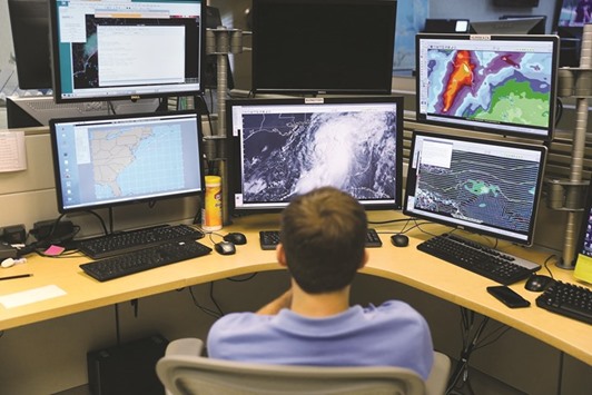Hurricane specialist Eric Blake works at the National Hurricane Centre to track the path of Tropical Storm Hermine, which strengthened yesterday and is expected to make landfall along Floridau2019s Gulf Coast.
