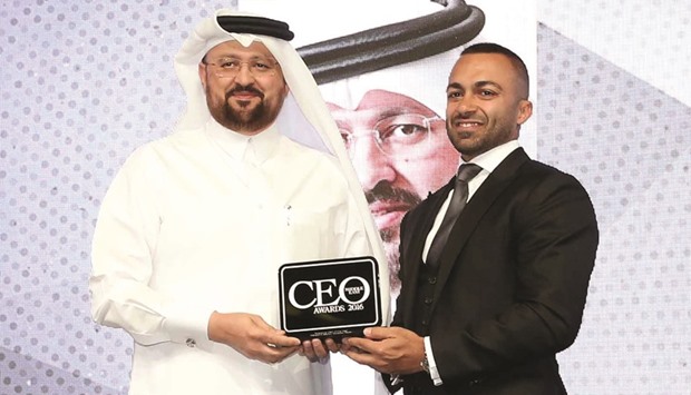 Waleed al-Sayed accepting the award in Dubai on Monday night.   