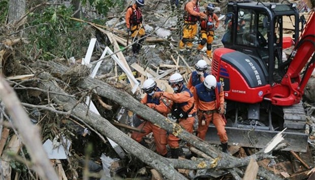 Firefighters search for the missing after Typhoon Lionrock made landfall in Iwaizumi, Iwate prefecture on Friday.