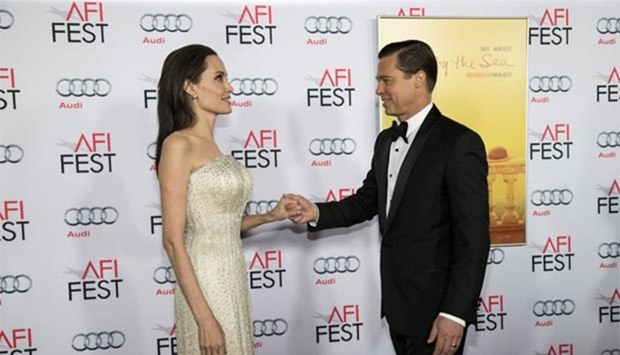 Angelina Jolie and Brad Pitt hold hands in this file photo taken during the opening night of AFI FEST 2015 in Hollywood, California last November.