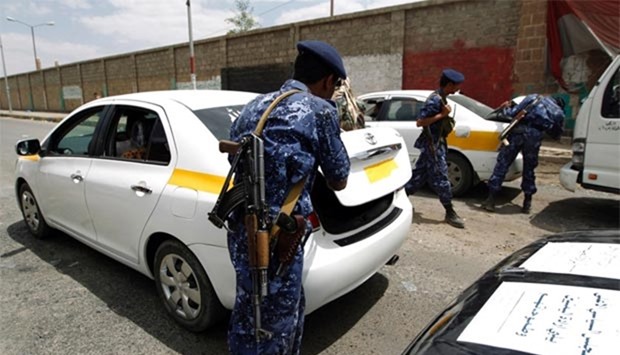 Yemeni soldiers search cars at a checkpoint as authorities tighten up security measures in Sanaa.