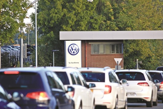 Volkswagen automobiles queue to enter its headquarters in Wolfsburg, Germany. VW faces Germanyu2019s biggest investor lawsuit as attorneys filed complaints totalling $9.2bn related to the diesel emissions scandal that wiped out a third of the companyu2019s market value.