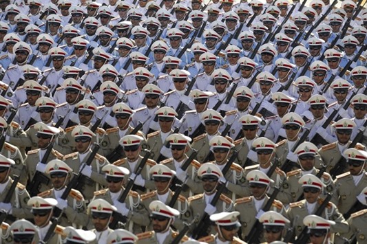 Iranian soldiers march during the annual military parade in Tehran yesterday, marking the anniversary of the1980-1988 Iran-Iraq war.
