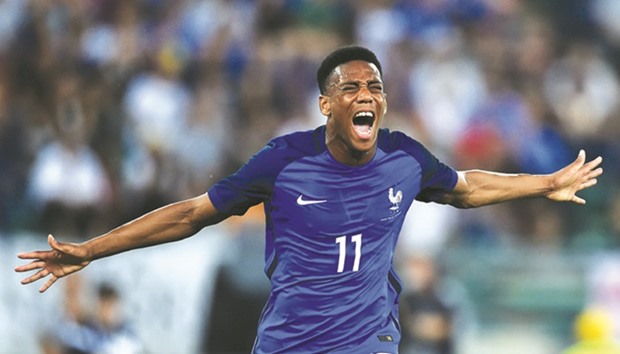 Franceu2019s forward Anthony Martial celebrates after scoring a goal during the friendly match against Italy at the San Nicola stadium in Bari.