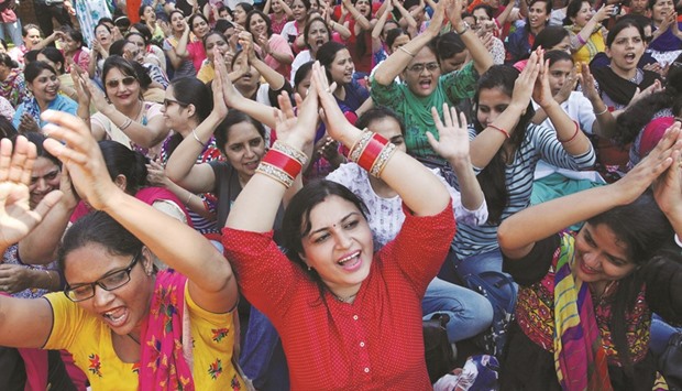 Nurses shouting anti-government slogans during a protest, as part of a nationwide strike, in Chandigarh yesterday.