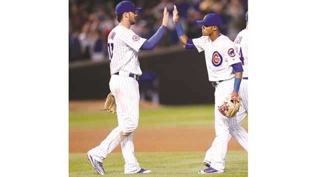 Chicago Cubs shortstop Addison Russell (right) celebrates with third baseman Kris Bryant their 5-4 win against the San Francisco Giants at Wrigley Field. PICTURE: USA TODAY Sports