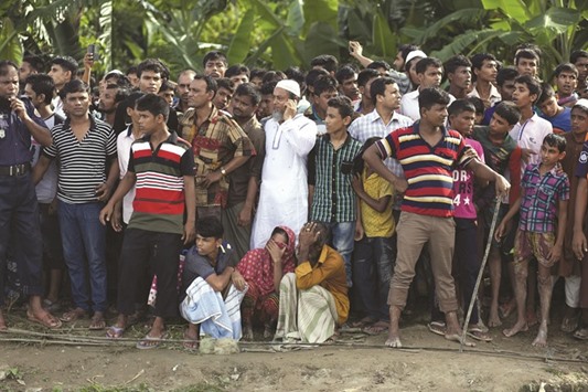 Relatives wait for news after an overcrowded ferry sank in southern Barisal district.