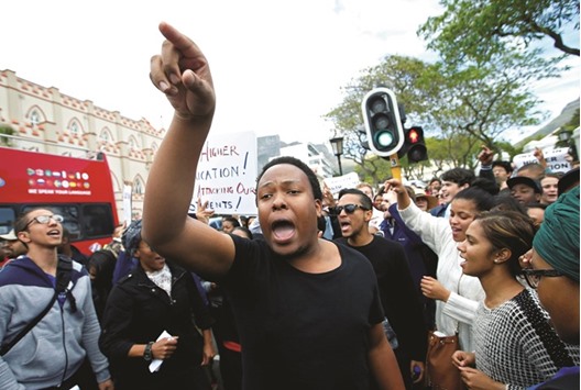 University students and staff protest yesterday outside Parliament in Cape Town.