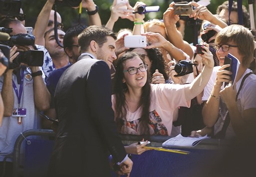 Gyllenhaal poses with fans before a photocall for Nocturnal Animals, presented in competition at the 73rd Venice Film Festival yesterday.