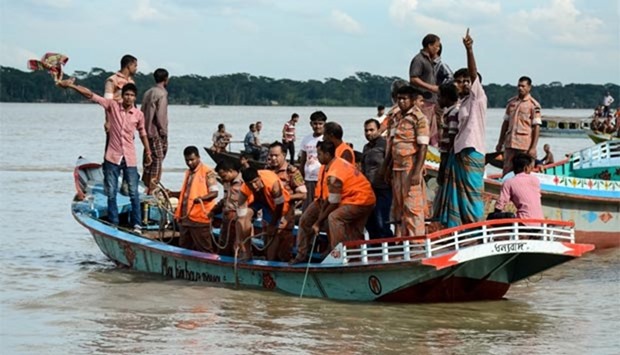 Rescue workers look for survivors after a ferry sank in the southern district of Barisal on Wednesday.
