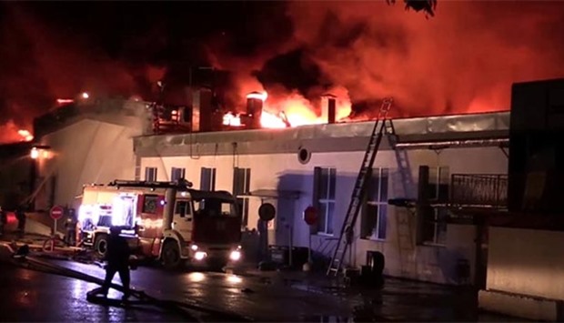 A still image, taken from video footage and released by the Russian emergency services ministry on Friday, shows a warehouse containing plastic materials on fire in Moscow.