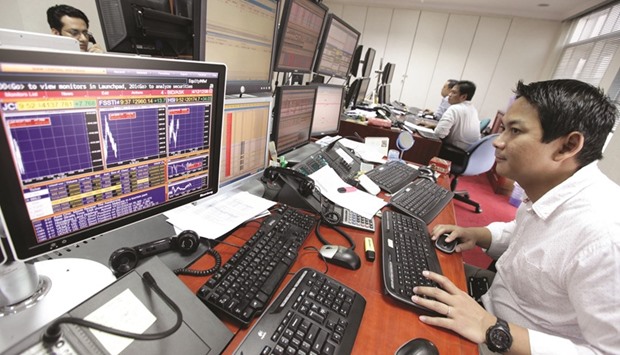 A trader looking at his screen as he keeps an eye on the stock prices at a securities brokerage in Jakarta. The Jakarta Composite Index has fallen 2.6% to 5,321.841 from this yearu2019s highest close on August 18 amid high valuations and a broader selloff in emerging markets.