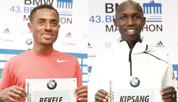 Combo picture shows Marathon runners Ethiopian Kenenisa Bekele (L) and Kenyan Wilson Kipsang showing their bib numbers during a press conference on the eve of the Berlin marathon yesterday.
