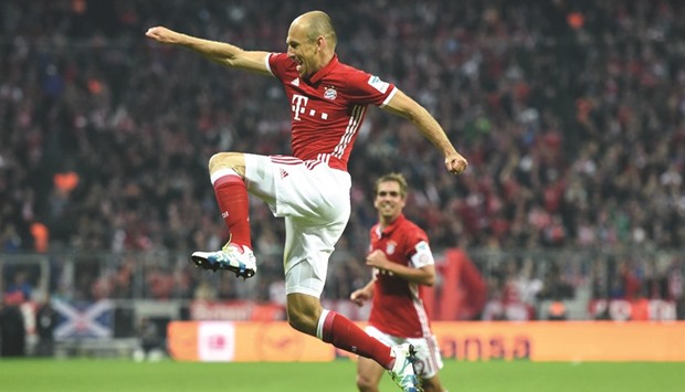 Bayern Munichu2019s Arjen Robben celebrates after scoring a goal against Hertha Berlin during their Bundesliga match in Munich on Tuesday. (AFP)