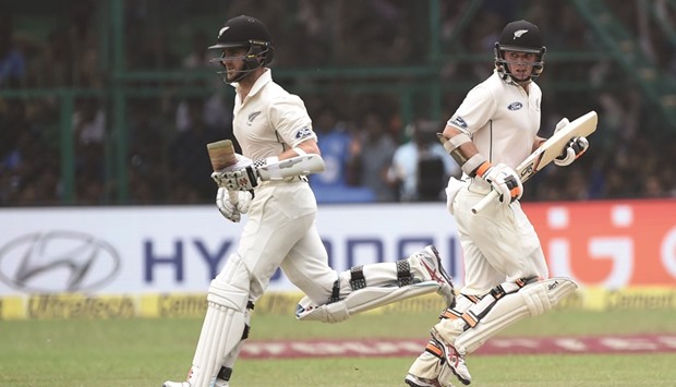New Zealandu2019s Tom Latham (R) and captain Kane Williamson run between the wickets during the second day of the first Test match against at Green Park Stadium in Kanpur yesterday.