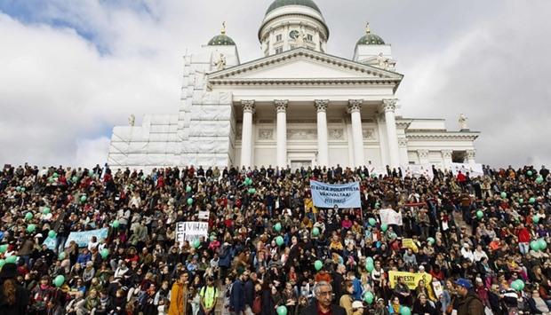 Participants demonstrate against racism and fascism in Helsinki, Finland on September 24, 2016 after a counter protester died on a farright demonstration