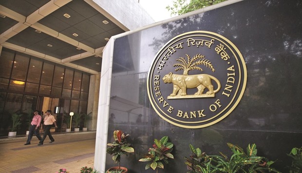 A signage of the Reserve Bank of India is displayed at the entrance to the banku2019s headquarters in Mumbai. Indian Prime Minister Narendra Modiu2019s administration on Thursday announced three candidates to join an equal number of RBI representatives on a new monetary policy committee, paving the way for Indiau2019s first collective interest-rate decision.