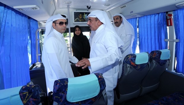 Minister of Transport HE Jassim Saif al-Sulaiti (right) and Minister of Education and Higher Education Mohamed bin Abdul Wahed al-Hammadi inside a new school bus at the launch ceremony held at Karwa Training Centre on September 22. PICTURE: Jayaram