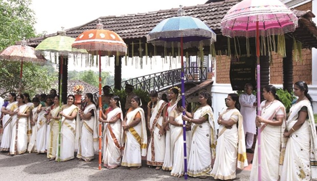 Women members of the Bharatiya Janata Party get ready to give a traditional welcome to party leaders attending the national council meeting in Kozhikode, Kerala.