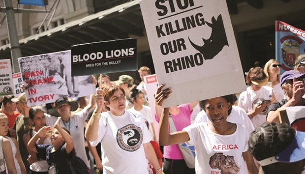 Animal rights activists demonstrate outside the Sandton convention center in Johannesburg.