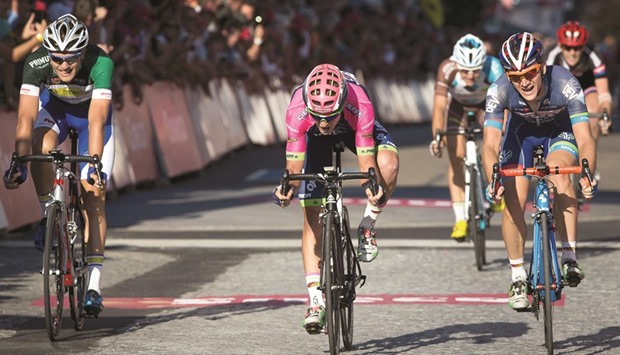 Sloveniau2019s Luka Pibernik (C) of Lampre-Merida crossed the finish line ahead of Belgian Bert Van Lerberghe (L) of team Topsport Vlaanderen - Baloise and British Mark McNally (R) of Wanty-Groupe Gobert the sixth stage of the Eneco Tour cycling race, a 197.2 km race from Riemst to Lanaken in Belgium yesterday. (AFP)