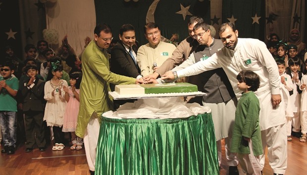 CELEBRATION: Sohni Dharti chairman Anwar Ali Rana along with other guests cut the cake at an event in Al Khor recently.