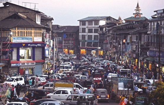 Shoppers and commuters pass through Lal Chowk, the main market in central Srinagar, yesterday. Markets across Kashmir opened for the first time in 79 days after separatist leaders called for businesses to open at 2pm. More than 80 Kashmiris have died in the two months since rebel leader Burhan Wani was killed, making it one of the worst bouts of violence since a full-blown armed rebellion was at its peak in the 1990s. The Kashmir Valley and the summer capital Srinagar have seen ongoing curfews amid the unrest.