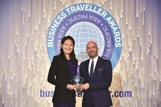 Johannes receiving the u2018Business Traveller Awardu2019 from Hong Kongu2019s 2016 Olympian Yvette Kong.