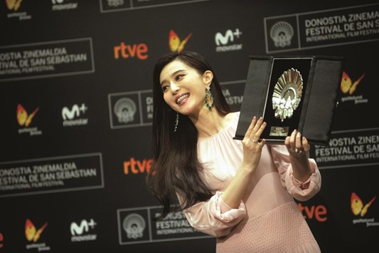 Fan Bingbing holds the Concha de Plata (Silver Shell) award for best actress at the San Sebastian Film Festival.
