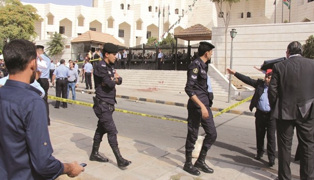 Jordanian police cordon off the area where Nahed Hattar was shot dead in Amman yesterday.