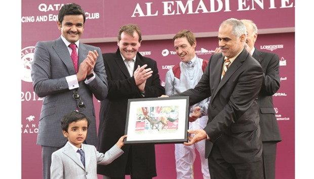 Al Emadi Enterprises CEO Mohamed al-Emadi presents the trophy to Sheikh Hamad bin Joaan al-Thani after Olympic Glory won 2012 Prix Jean-Luc Lagardere.