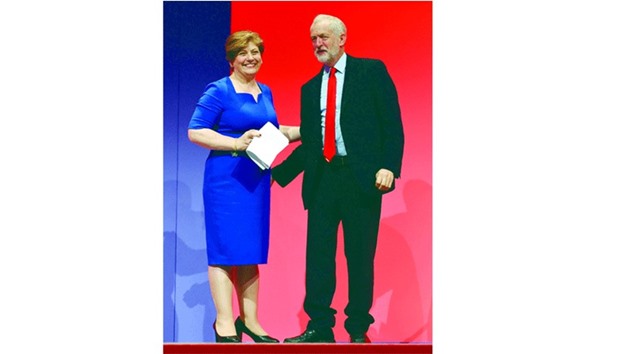 Shadow foreign secretary Emily Thornberry stands besides Labour leader Jeremy Corbyn after delivering her speech on the second day of the Labour Party Conference in Liverpool yesterday.