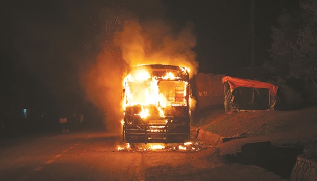 A May 12, 2015, file photo of a bus on fire on the infamous Kampala-Masaka road in Buwama village. The passengers luckily had time to get out of the vehicle but they lost their belongings.