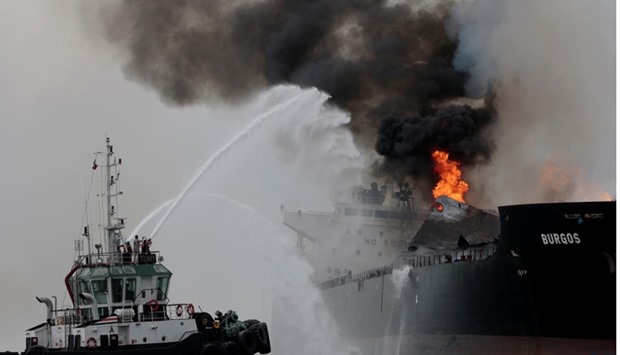 Firefighters extinguish a fire on an oil tanker of Mexican state oil company Pemex named ,Burgos, off the coast of Boca del Rio in Veracruz state, Mexico