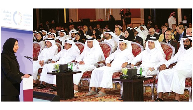 HE the Minister of Public Health Dr Hanan Mohamed al-Kuwari addressing the forum yesterday. HE the Prime Minister and Inteior Minister Sheikh Abdullah bin Nasser bin Khalifa  al-Thani along with other ministers and senior officials at the forum yesterday. PICTURES: Nasar T K