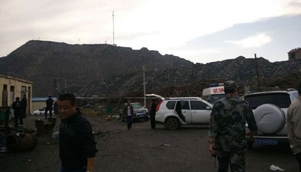 Rescue workers at the site of explosion. Picture courtesy: People's Daily,China