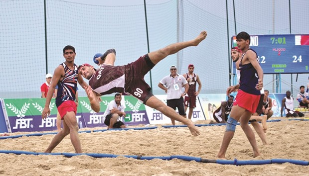 Action from the Asian Beach Games handball match between Qatar (in maroon) and India on Monday.