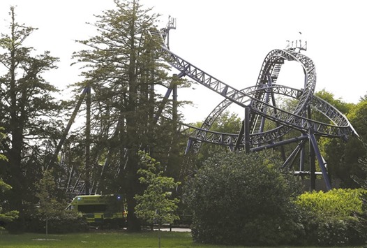 An ambulance drives past the Smiler ride at Alton Towers in Alton, Britain.