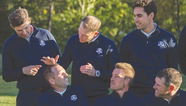 Swedenu2019s Henrik Stenson (third from right), Great Britainu2019s Lee Westwood (right) and Spainu2019s Rafa Cabrera Bello (second from right) look on as Great Britainu2019s Danny Willett (third from left) and European team vice-captain Padraig Harrington of Ireland (left) tease Spainu2019s Sergio Garcia about his hair during team photos at Hazeltine National Golf Course yesterday. (AFP)