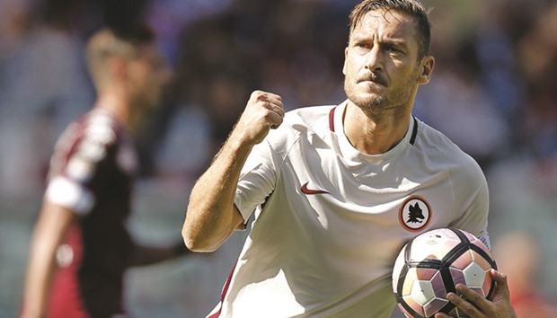 Francesco Totti celebrates after scoring against Torino on Sunday. (AFP)